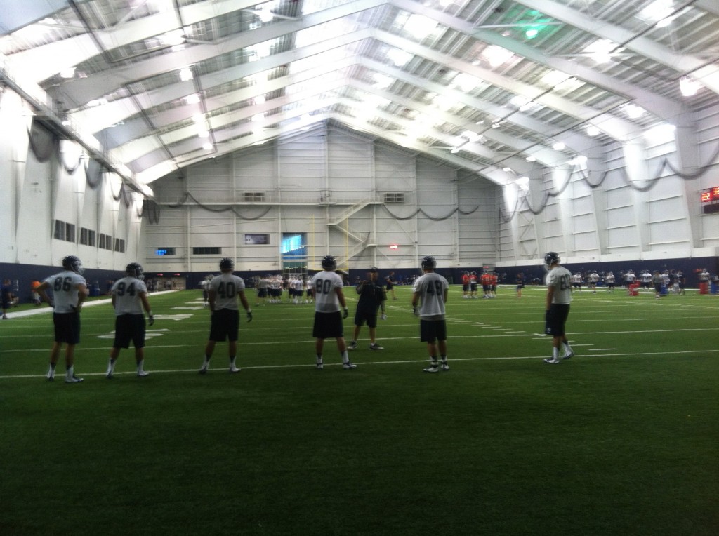 The Huskies worked out inside Saturday because of the rain (Ken Davis photo)