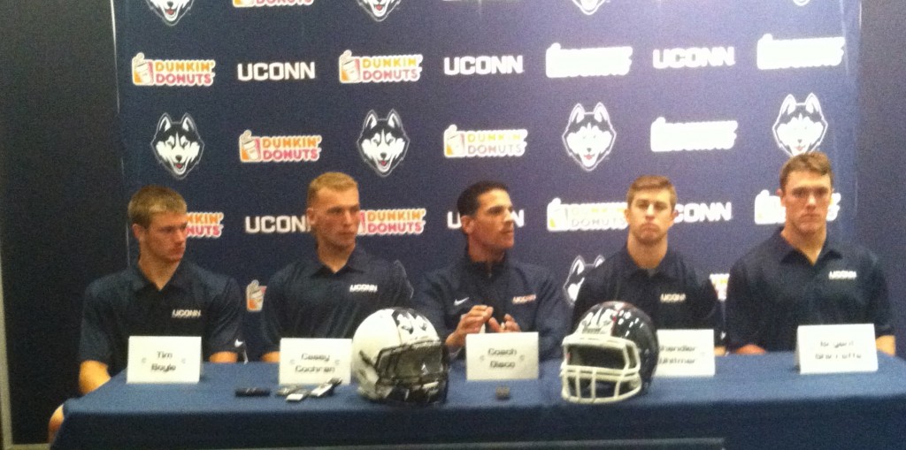 Coach Bob Diaco, middle, named Cochran as starting QB at this press conference  in Storrs.