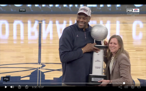 Ewing receives the championship trophy from Big East commissioner Val Ackerman